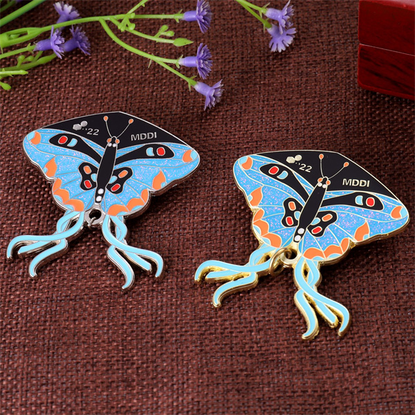 MMDI blue butterfly lapel pin 